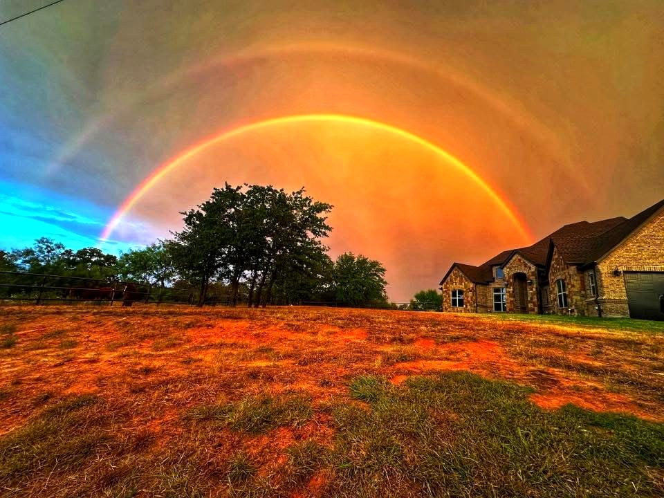 A double rainbow over the pasture at Flying Spur Ranch