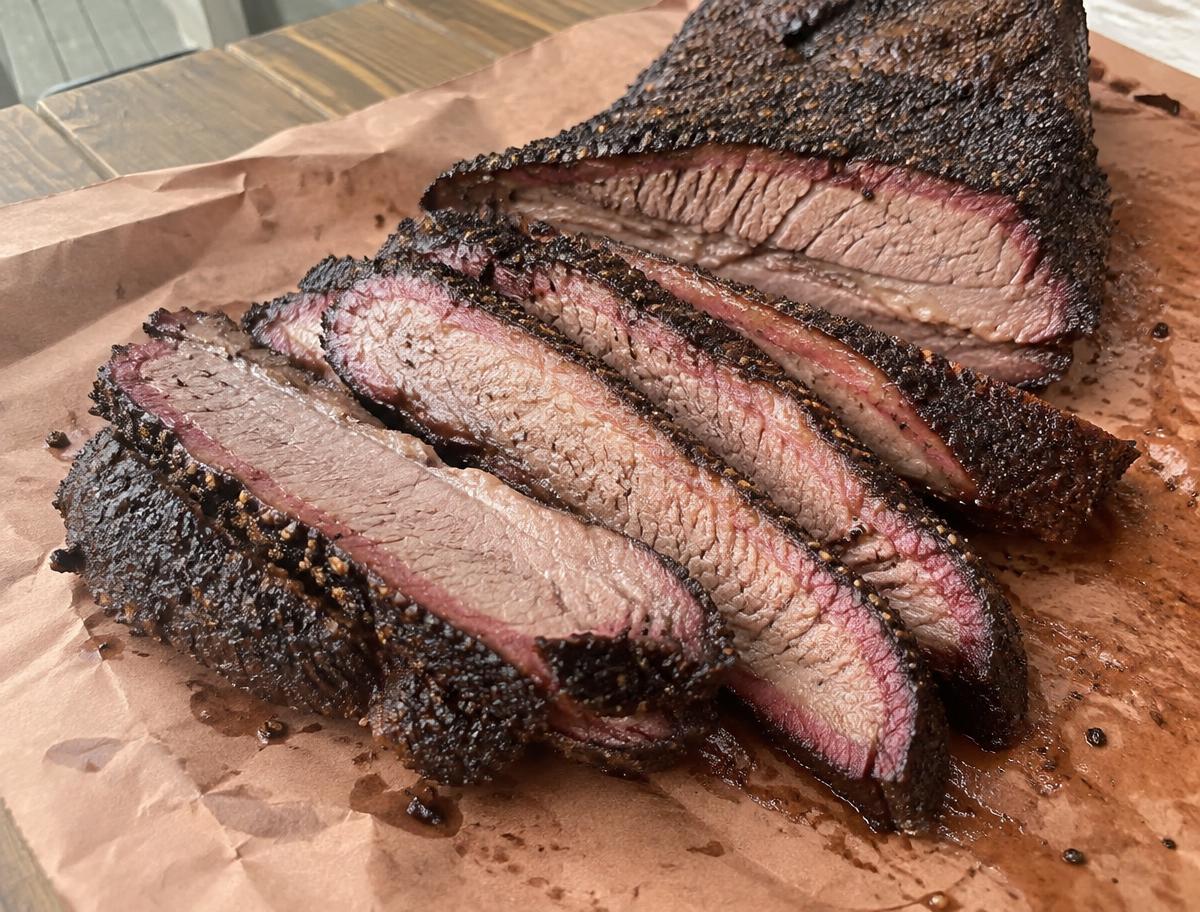 Sliced Texas smoked brisket on butcher paper